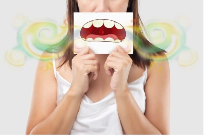 Representación de una persona con mal aliento utilizando una ilustración para explicar la halitosis y la importancia de la higiene oral.